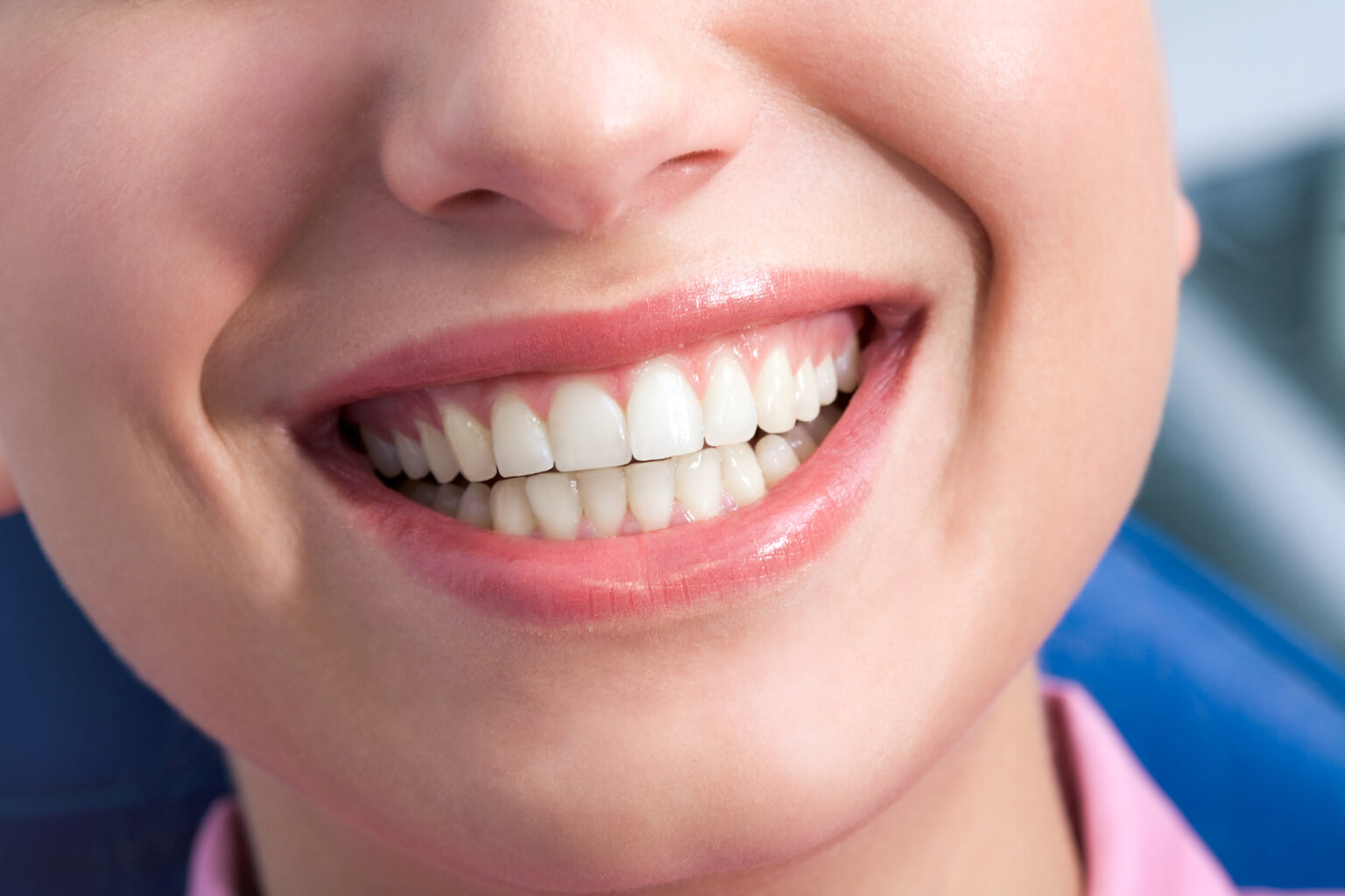 Close-up of a smiling person showing healthy teeth thanks to an affordable Dallas dentist.