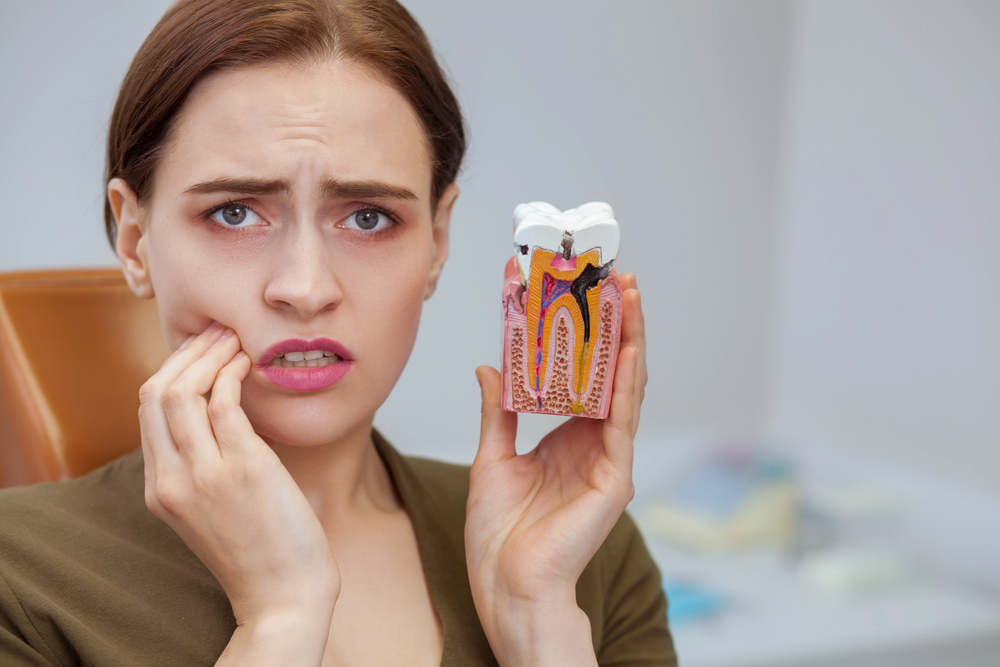 woman with toothache needs Dallas emergency dentist now